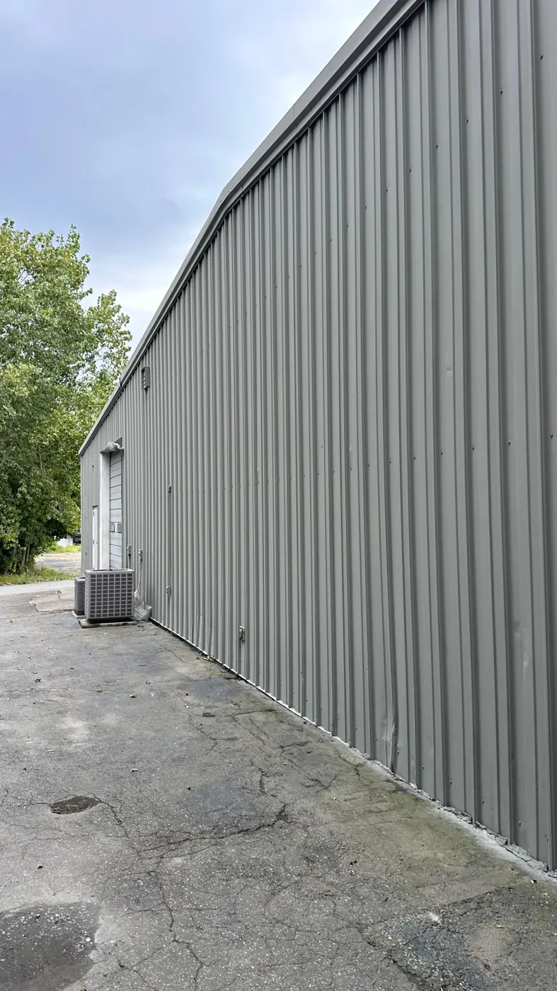 Exterior House Painting in Woonsocket, RI — photo 5 — Finished side wall from the parking lot