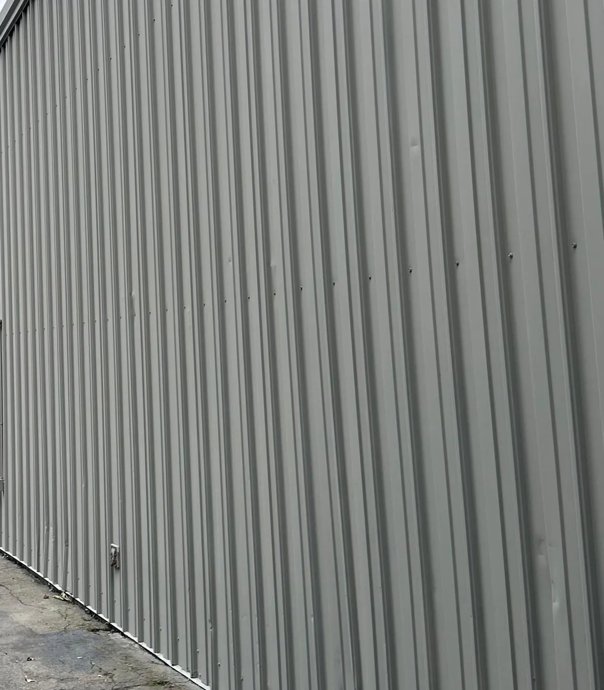 Exterior House Painting in Woonsocket, RI — photo 6 — Detail: even coverage on the ribbed panels