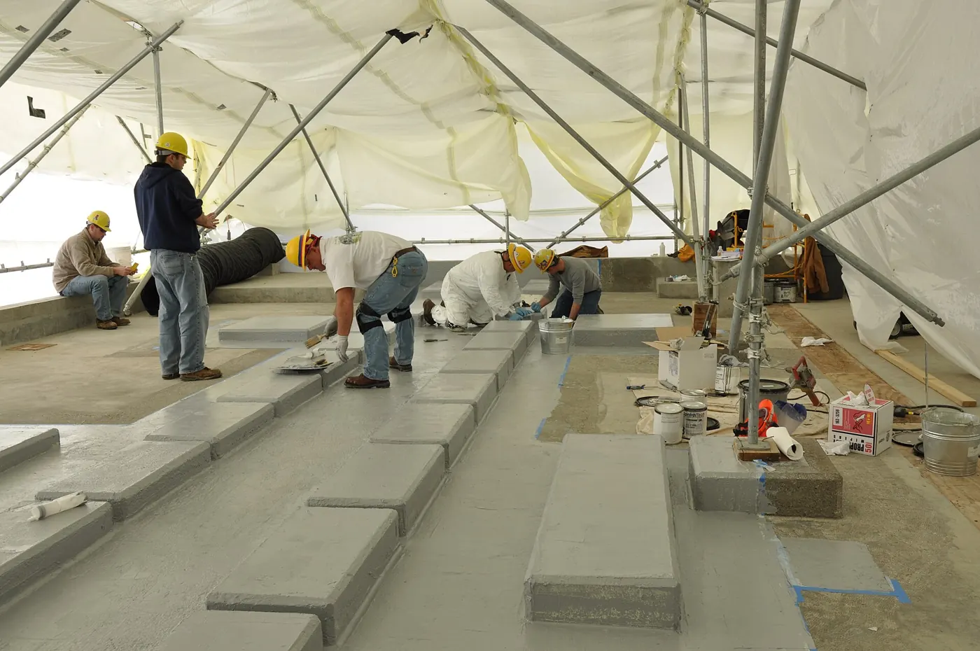 Epoxy Floor Coating in Bellingham, MA — photo 4 — Base coat going down section by section