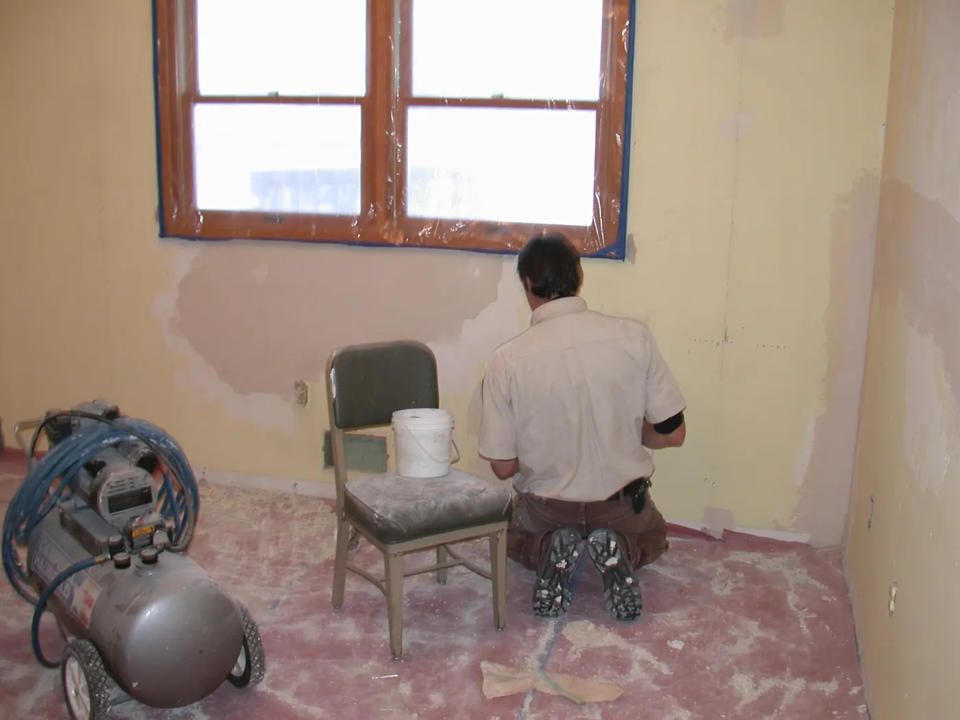 Interior Painting in Cumberland, RI — photo 4 — Skim-coating the walls after the paper came off