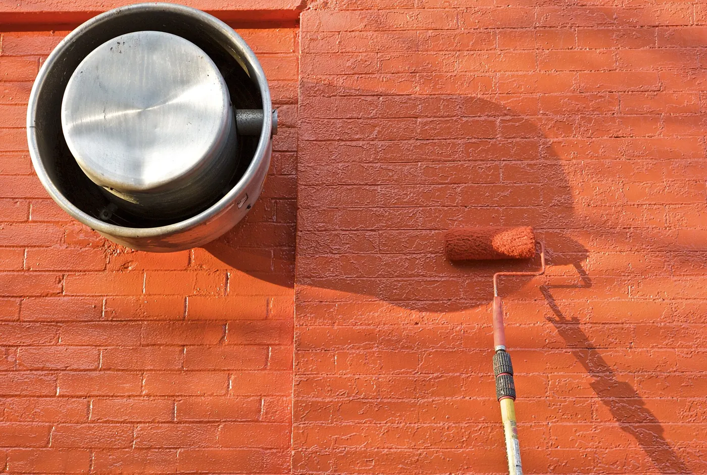 Exterior House Painting in Cumberland, RI — photo 4 — Rolling the finish coat